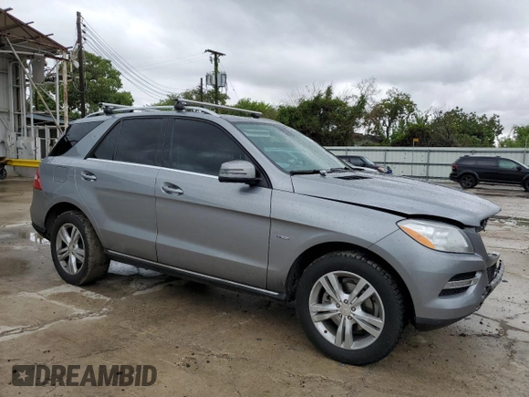2012 Mercedes-Benz M 350 with VIN 4JGDA5HB2CA027986, listed as a Copart auction lot 71714874 with 165,916 mi miles and Salvage title. Bid and sale history available at DreamBid. Image 4.