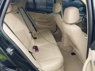2014 BMW X1 sDrive28i with VIN WBAVM1C54EVW46561, listed as a IAAI auction lot 41880387 with 125,096 mi miles. Bid and sale history available at carsss.com. Image 8.