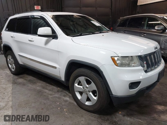 2013 Jeep Grand Cherokee Laredo with VIN 1C4RJFAG9DC532919, listed as a IAAI auction lot 40918828 with 140,093 mi miles. Bid and sale history available at carsss.com. Image 1.