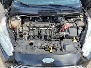 2014 Ford Fiesta Titanium z VIN 3FADP4FJXEM228098, wystawiony jako Copart lot #55173975 z przebiegiem 109 311 mil mil oraz Szkoda całkowita • Salvage title. Historia ofert i sprzedaży dostępna na DreamBid. Obrazek 12.
