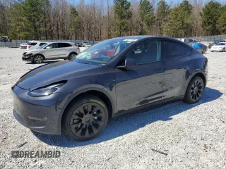 2025 Tesla Model Y Long Range with VIN 7SAYGAEEXSF253326, listed as a Copart auction lot 49527965 with 5,803 mi miles and Salvage Title. Bid and sale history available at DreamBid. Image 1.