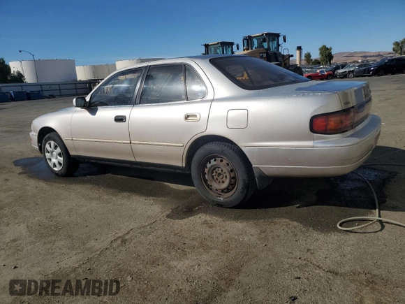 1994 Toyota Camry LE z VIN JT2GK12EXR0070117, wystawiony jako Copart lot #75997244 z przebiegiem 185 759 mil mil oraz Czysty tytuł • Clean title. Historia ofert i sprzedaży dostępna na DreamBid. Obrazek 2.