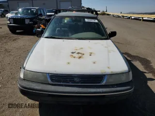 1994 Subaru Legacy L with VIN 4S3BJ6337R7955431, listed as a Copart auction lot 70200794 with 281,694 mi miles and Salvage Title. Bid and sale history available at DreamBid. Image 5.
