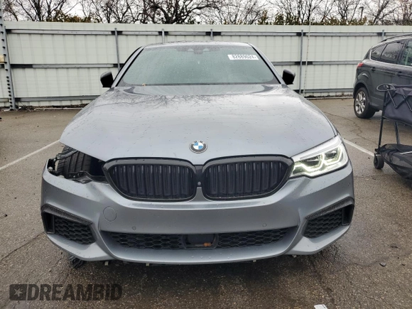 2018 BMW 5 Series M550i xDrive with VIN WBAJB9C54JB286707, listed as a Copart auction lot 49158435 with 74,307 mi miles and Salvage title. Bid and sale history available at DreamBid. Image 5.