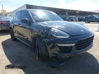 2015 Porsche Cayenne Turbo z VIN WP1AC2A2XFLA80727, wystawiony jako IAAI lot #42031257 z przebiegiem 83 368 mil mil oraz . Historia ofert i sprzedaży dostępna na DreamBid. Obrazek 1.