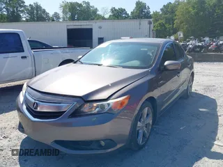 2014 Acura ILX Technology with VIN 19VDE1F73EE013345, listed as a IAAI auction lot 40193022 with 102,265 mi miles and . Bid and sale history available at DreamBid. Image 2.