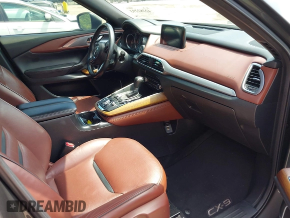 2016 Mazda CX-9 Signature with VIN JM3TCBEY9G0100579, listed as a IAAI auction lot 42282293 with 142,700 mi miles and . Bid and sale history available at DreamBid. Image 5.