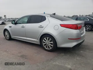2015 Kia Optima EX z VIN 5XXGN4A71FG396076, wystawiony jako Copart lot #55306755 z przebiegiem 59 330 mil mil oraz Szkoda całkowita • Salvage title. Historia ofert i sprzedaży dostępna na DreamBid. Obrazek 2.