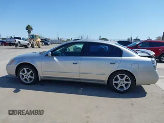 2002 Nissan Altima SE with VIN 1N4BL11E72C169164, listed as a IAAI auction lot 41992002 with 100,211 mi miles. Bid and sale history available at carsss.com. Image 14.