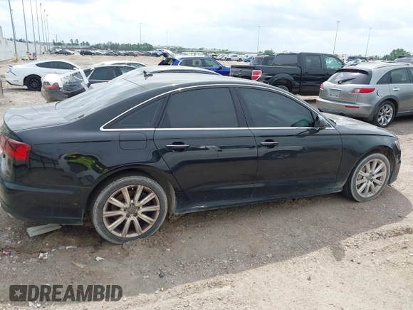 2016 Audi A6 2.0T Premium Plus with VIN WAUGFAFC1GN012799, listed as a IAAI auction lot 42141346 with 101,506 mi miles. Bid and sale history available at carsss.com. Image 13.