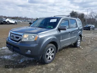 2011 Honda Pilot Touring with VIN 5FNYF4H98BB016012, listed as a IAAI auction lot 41634844 with 202,160 mi miles. Bid and sale history available at carsss.com. Image 2.