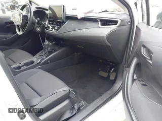 2023 Toyota Corolla Hybrid LE with VIN JTDBCMFE3PJ010097, listed as a IAAI auction lot 41786656 with 50,775 mi miles. Bid and sale history available at carsss.com. Image 5.