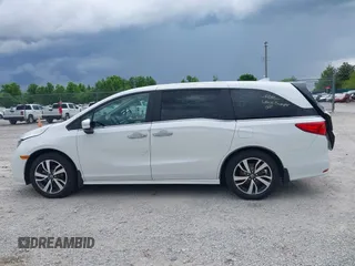2023 Honda Odyssey Touring with VIN 5FNRL6H88PB079716, listed as a IAAI auction lot 42208628 with 26,679 mi miles and . Bid and sale history available at DreamBid. Image 15.