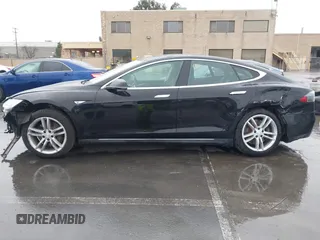 2013 Tesla Model S with VIN 5YJSA1CN0DFP20053, listed as a IAAI auction lot 41470660 with 61,568 mi miles and . Bid and sale history available at DreamBid. Image 15.