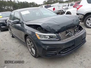 2016 Volkswagen Passat 1.8T S with VIN 1VWAT7A33GC061751, listed as a IAAI auction lot 41382115 with 105,926 mi miles. Bid and sale history available at carsss.com. Image 1.