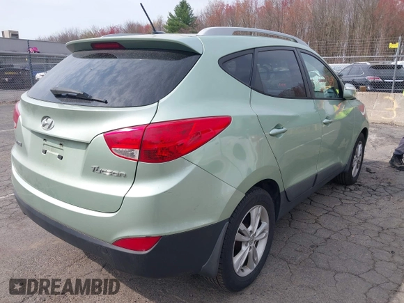 2013 Hyundai Tucson GLS with VIN KM8JU3AC7DU580229, listed as a IAAI auction lot 42127349 with 204,975 mi miles. Bid and sale history available at carsss.com. Image 4.