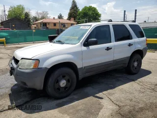 2004 Ford Escape XLS with VIN 1FMCU92114DA15564, listed as a Copart auction lot 59358015 with 186,135 mi miles and Salvage title. Bid and sale history available at DreamBid. Image 1.
