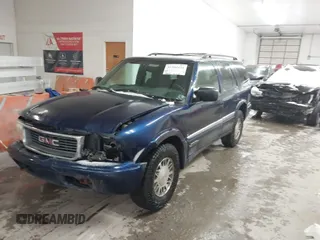 1999 GMC Jimmy SLE with VIN 1GKDT13W8X2534672, listed as a IAAI auction lot 41562434 with 240,145 mi miles. Bid and sale history available at carsss.com. Image 2.