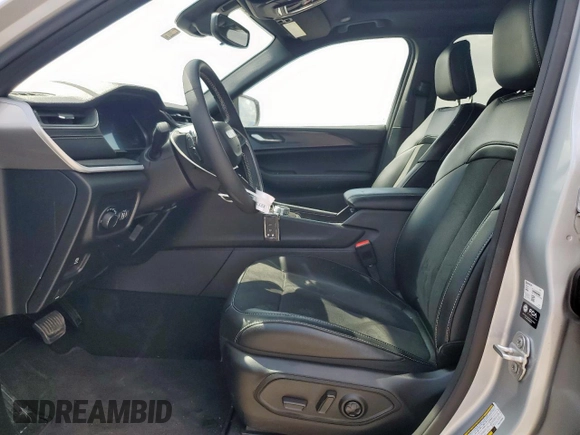 2024 Jeep Grand Cherokee Laredo X with VIN 1C4RJGAG2RC243586, listed as a Copart auction lot 56725245 with 10,735 mi miles and Salvage title. Bid and sale history available at DreamBid. Image 7.