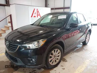 2016 Mazda CX-5 Touring with VIN JM3KE2CY7G0867355, listed as a IAAI auction lot 41963169 with 117,727 mi miles and . Bid and sale history available at DreamBid. Image 2.