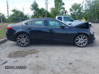 2016 Mazda Mazda6 i Touring with VIN JM1GJ1V53G1431880, listed as a IAAI auction lot 42079970 with 111,179 mi miles. Bid and sale history available at carsss.com. Image 13.