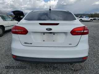 2016 Ford Focus SE with VIN 1FADP3F21GL284681, listed as a Copart auction lot 51140975 with 141,704 mi miles and Salvage Title. Bid and sale history available at DreamBid. Image 6.
