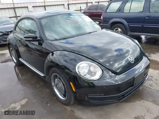 2012 Volkswagen Beetle 2.5L w/Sun/Sound/Nav PZEV with VIN 3VWHP7AT0CM623536, listed as a IAAI auction lot 41351333 with 106,600 mi miles. Bid and sale history available at carsss.com. Image 1.
