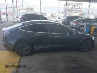 2020 Tesla Model 3 Standard Range Plus with VIN 5YJ3E1EA8LF743405, listed as a IAAI auction lot 41923592 with 81,901 mi miles. Bid and sale history available at carsss.com. Image 13.