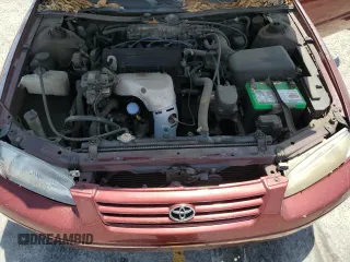 1999 Toyota Camry LE z VIN JT2BG22K6X0274398, wystawiony jako Copart lot #57263795 z przebiegiem 202 944 mil mil oraz Szkoda całkowita • Salvage title. Historia ofert i sprzedaży dostępna na DreamBid. Obrazek 11.