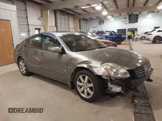 2005 Nissan Maxima SE z VIN 1N4BA41E35C877021, wystawiony jako IAAI lot #41303387 z przebiegiem 96 883 mil mil oraz . Historia ofert i sprzedaży dostępna na DreamBid. Obrazek 1.