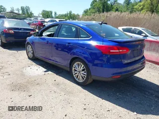 2015 Ford Focus Titanium with VIN 1FADP3J20FL304828, listed as a IAAI auction lot 42144101 with 199,715 mi miles and . Bid and sale history available at carsss.com. Image 3.