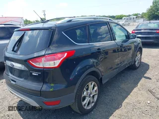 2015 Ford Escape Titanium with VIN 1FMCU9J96FUC01790, listed as a IAAI auction lot 42844336 with 133,005 mi miles and . Bid and sale history available at DreamBid. Image 4.