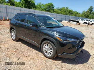 2023 Toyota Corolla Cross LE with VIN 7MUCAAAG3PV058094, listed as a Copart auction lot 57983105 with 30,593 mi miles and Salvage title. Bid and sale history available at DreamBid. Image 4.