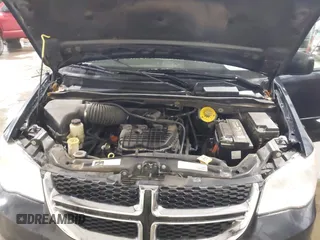 2014 Dodge Grand Caravan SXT with VIN 2C4RDGCGXER154709, listed as a IAAI auction lot 41117603 with 214,872 mi miles and . Bid and sale history available at DreamBid. Image 10.