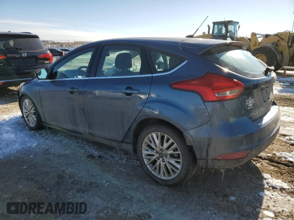 2018 Ford Focus Titanium z VIN 1FADP3N2XJL297048, wystawiony jako Copart lot #61579925 z przebiegiem 68 774 mil mil oraz Szkoda całkowita • Salvage title. Historia ofert i sprzedaży dostępna na DreamBid. Obrazek 2.