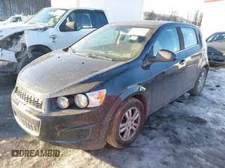 2013 Chevrolet Sonic LT with VIN 1G1JC6SB2D4256838, listed as a IAAI auction lot 41443769 with 98,839 mi miles. Bid and sale history available at carsss.com. Image 2.