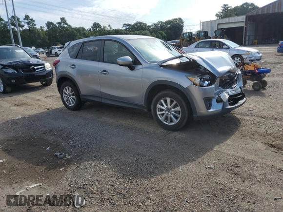 2015 Mazda CX-5 Touring with VIN JM3KE2CY7F0435914, listed as a Copart auction lot 61885704 with 0 mi miles and Salvage Title. Bid and sale history available at carsss.com. Image 4.