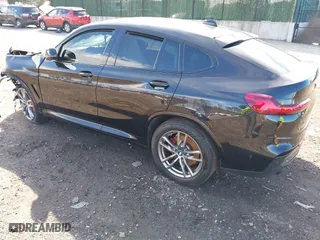 2021 BMW X4 M40i with VIN 5UX2V5C03M9H54824, listed as a IAAI auction lot 41817714 with 34,880 mi miles. Bid and sale history available at carsss.com. Image 3.