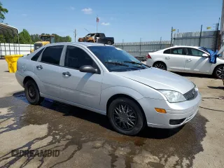 2007 Ford Focus S z VIN 1FAFP34N97W264411, wystawiony jako Copart lot #53251655 z przebiegiem 159 516 mil mil oraz Szkody całkowita. Historia ofert i sprzedaży dostępna na DreamBid. Obrazek 4.