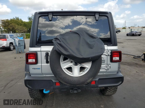 2023 Jeep Wrangler z VIN 1C4JJXN64PW630179, wystawiony jako Copart lot #53879415 z przebiegiem 27 905 mil mil oraz Czysty tytuł • Clean title. Historia ofert i sprzedaży dostępna na DreamBid. Obrazek 6.