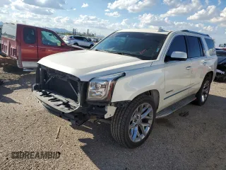 2015 GMC Yukon Denali with VIN 1GKS2CKJ0FR508598, listed as a Copart auction lot 71212924 with 133,220 mi miles and Salvage Title. Bid and sale history available at carsss.com. Image 1.