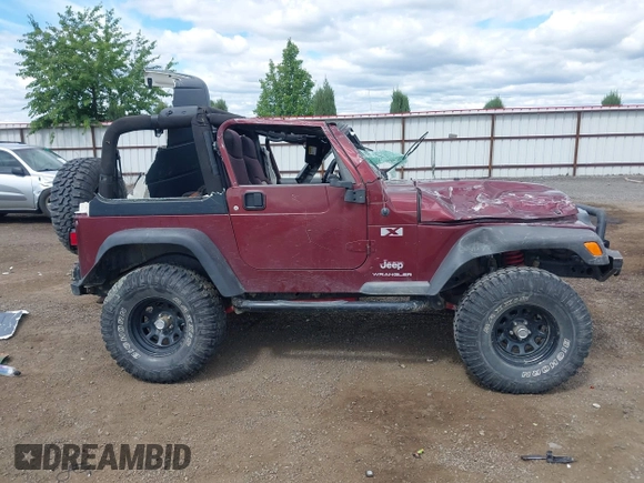 2003 Jeep Wrangler X z VIN 1J4FA39S73P349014, wystawiony jako IAAI lot #42582747 z przebiegiem 50 525 mil mil oraz . Historia ofert i sprzedaży dostępna na DreamBid. Obrazek 14.