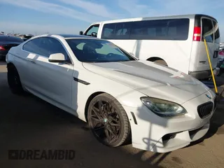 2012 BMW 6 Series 650i with VIN WBALX3C52CC528401, listed as a IAAI auction lot 42046910 with 105,844 mi miles. Bid and sale history available at carsss.com. Image 1.