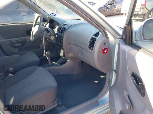 2003 Hyundai Accent GL with VIN KMHCG45C73U455357, listed as a IAAI auction lot 41395159 with 86,488 mi miles. Bid and sale history available at carsss.com. Image 5.