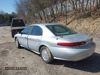 1999 Mercury Sable LS z VIN 1MEFM53S7XA622932, wystawiony jako IAAI lot #41708531 z przebiegiem 155 702 mil mil oraz . Historia ofert i sprzedaży dostępna na DreamBid. Obrazek 3.