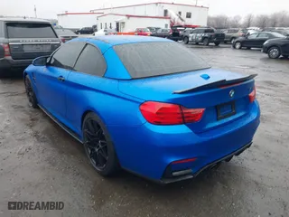 2015 BMW M4 with VIN WBS3U9C5XFJ968082, listed as a IAAI auction lot 41513593 with 57,715 mi miles. Bid and sale history available at carsss.com. Image 3.