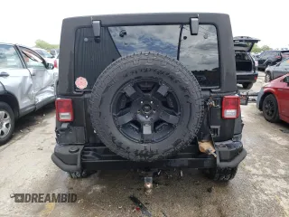 2013 Jeep Wrangler Unlimited Rubicon 10th Anniversary with VIN 1C4HJWFGXDL543660, listed as a Copart auction lot 61462104 with 115,897 mi miles and Salvage title. Bid and sale history available at DreamBid. Image 6.
