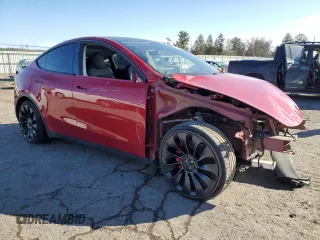 2023 Tesla Model Y Performance with VIN 7SAYGDEFXPF790747, listed as a Copart auction lot 42233855 with 25,452 mi miles and Salvage Title. Bid and sale history available at DreamBid. Image 4.