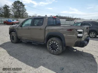 2022 Nissan Frontier PRO-4X with VIN 1N6ED1EK0NN671881, listed as a Copart auction lot 49579385 with 22,061 mi miles and Salvage Title. Bid and sale history available at carsss.com. Image 2.