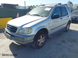 1999 Mercedes-Benz M-Class with VIN 4JGAB54E6XA144914, listed as a IAAI auction lot 42072406 with 125,901 mi miles. Bid and sale history available at carsss.com. Image 2.